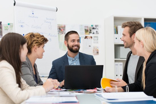 Smiling manager with his business team