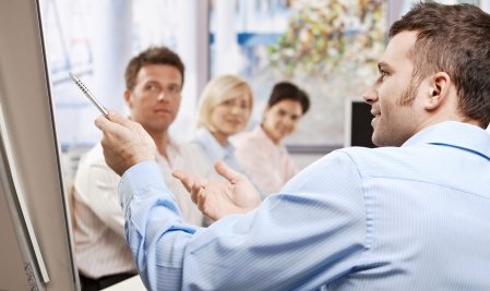 Businessman speaking on presentation